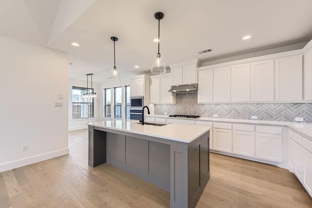 1717 Truro Ln, Fort Worth, TX 76052 - kitchen featuring a sink, stainless steel appliances, backsplash, light countertops, and recessed lighting