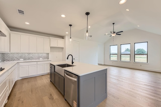 1717 Truro Ln, Fort Worth, TX 76052 - kitchen featuring dishwasher, ceiling fan, a sink, white cabinets, and lofted ceiling