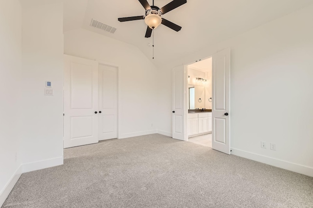 1717 Truro Ln, Fort Worth, TX 76052 - unfurnished bedroom featuring light carpet, baseboards, lofted ceiling, connected bathroom, and ceiling fan