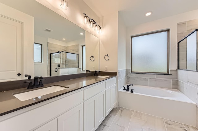1717 Truro Ln, Fort Worth, TX 76052 - full bathroom featuring a stall shower, a garden tub, double vanity, and recessed lighting