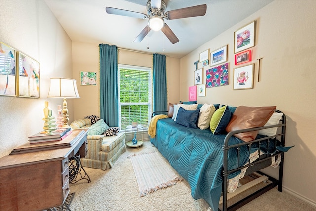 bedroom with carpet, baseboards, and a ceiling fan