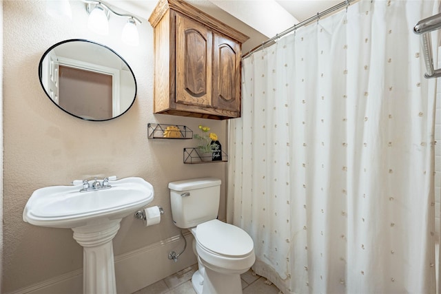 full bath with tile patterned floors, toilet, and a shower with shower curtain