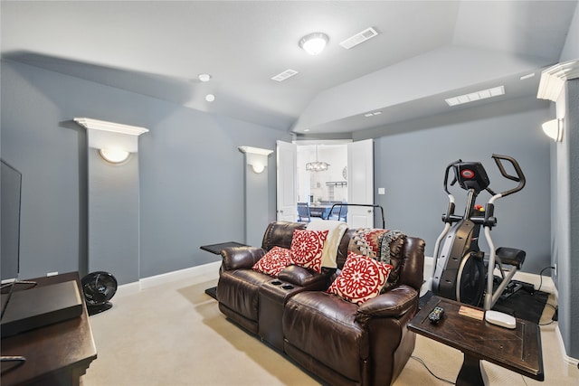 carpeted cinema with lofted ceiling