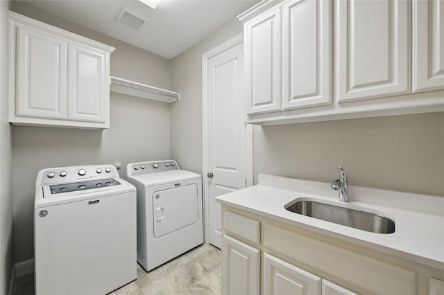 laundry area featuring cabinet space and independent washer and dryer