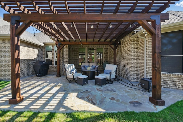 view of patio with a pergola and a grill