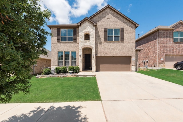 traditional home with an attached garage, brick siding, driveway, and a front lawn