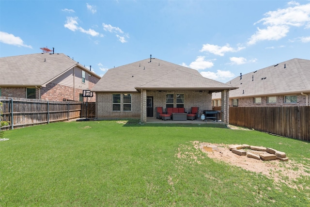 rear view of property featuring an outdoor hangout area, brick siding, and a patio area