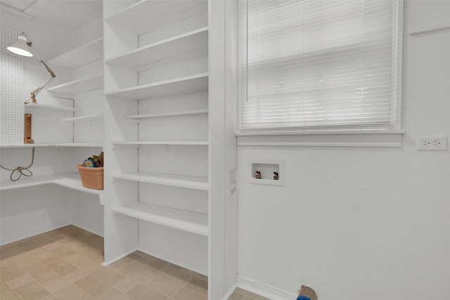 1501 W Day St, Denison, TX 75020 - laundry area featuring washer hookup and baseboards