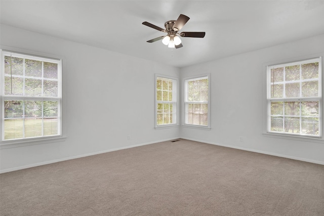 1501 W Day St, Denison, TX 75020 - carpeted empty room featuring baseboards and a ceiling fan