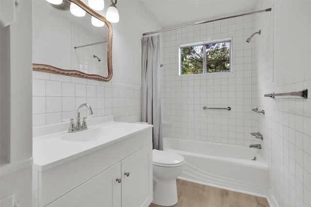 1501 W Day St, Denison, TX 75020 - full bath featuring tile walls, shower / bath combo, wood finished floors, toilet, and vanity