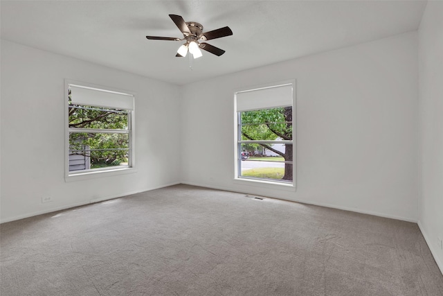 1501 W Day St, Denison, TX 75020 - carpeted empty room featuring a ceiling fan and baseboards