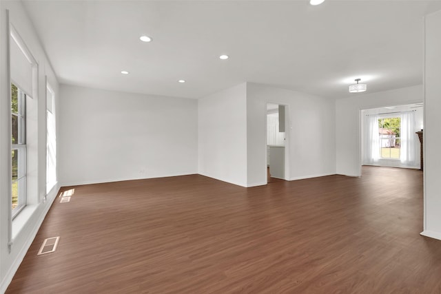 1501 W Day St, Denison, TX 75020 - empty room featuring dark wood-style floors, recessed lighting, and baseboards