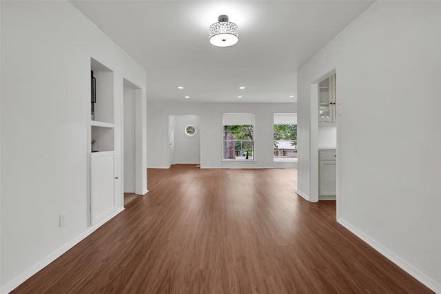 1501 W Day St, Denison, TX 75020 - corridor featuring wood finished floors, baseboards, and recessed lighting