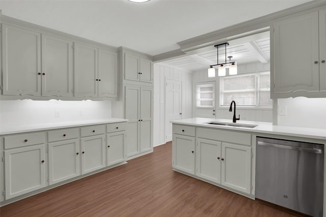 1501 W Day St, Denison, TX 75020 - kitchen with stainless steel dishwasher, a sink, wood finished floors, beam ceiling, and light countertops