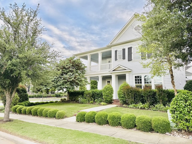 7501 Darrow Dr, Mckinney, TX 75071 - greek revival house with a balcony and a front lawn