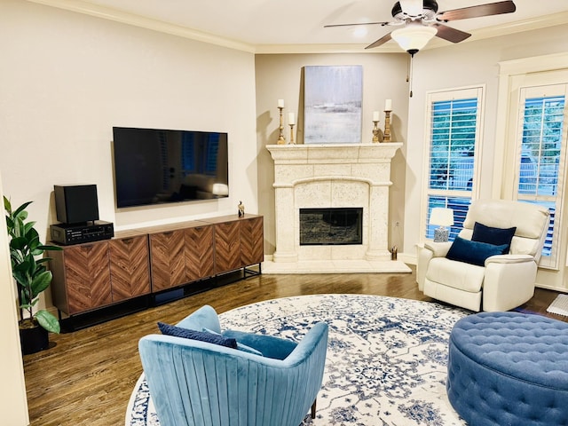 7501 Darrow Dr, Mckinney, TX 75071 - living room with wood finished floors, ornamental molding, a ceiling fan, and a premium fireplace