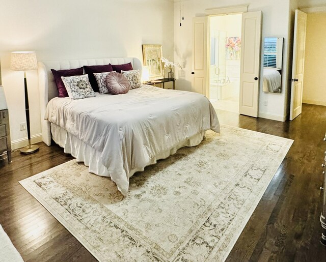 7501 Darrow Dr, Mckinney, TX 75071 - bedroom featuring dark wood-style flooring, baseboards, and ensuite bathroom