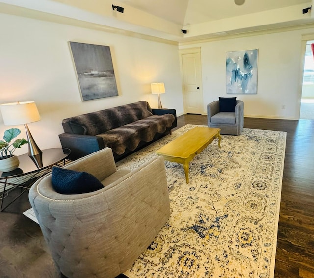 7501 Darrow Dr, Mckinney, TX 75071 - living room with dark wood-style floors, vaulted ceiling, and baseboards