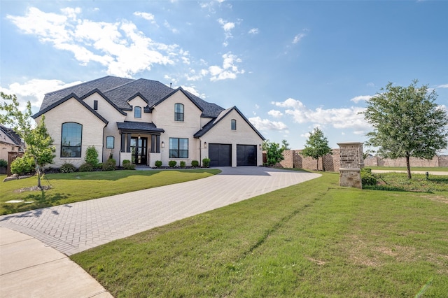 3228 Saddle Brook Rd, Celina, TX 75009 - french provincial home featuring driveway, a front lawn, and brick siding