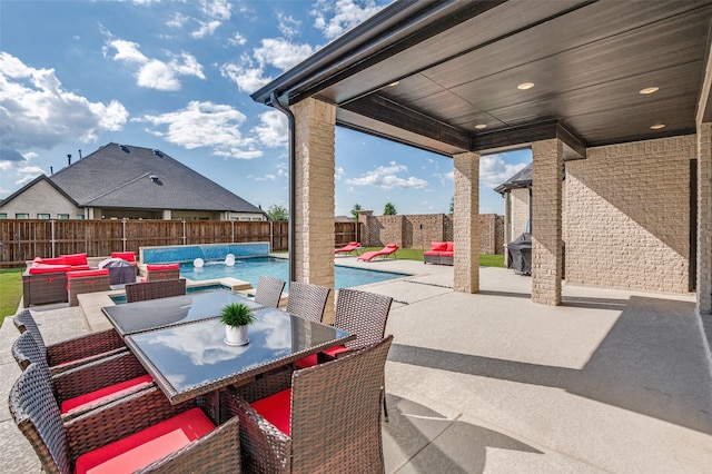 3228 Saddle Brook Rd, Celina, TX 75009 - fenced backyard featuring an outdoor hangout area, a patio area, and outdoor dining space