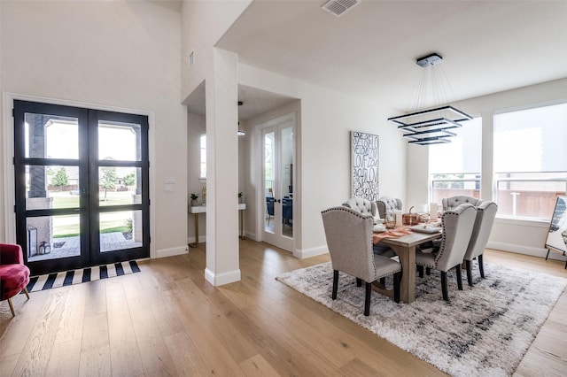 3228 Saddle Brook Rd, Celina, TX 75009 - dining space with french doors and light wood finished floors