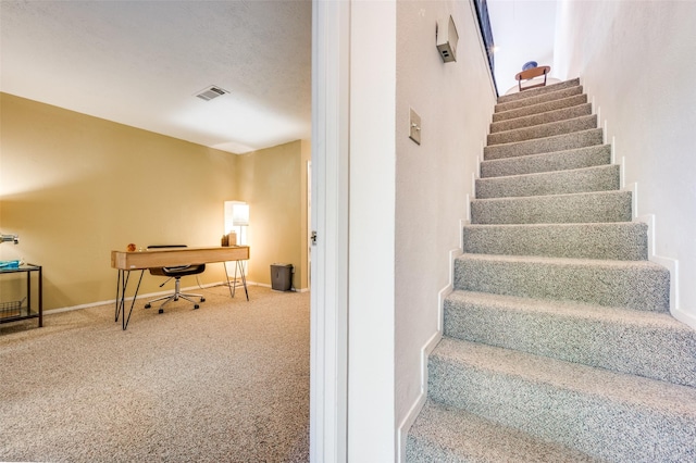 stairs with carpet and baseboards