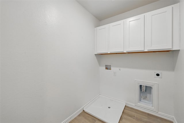 2832 Baneberry Ln, Mesquite, TX 75150 - washroom with cabinet space, hookup for a gas dryer, electric dryer hookup, washer hookup, and baseboards