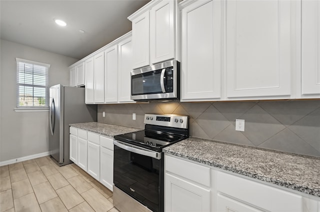 2832 Baneberry Ln, Mesquite, TX 75150 - kitchen with stainless steel appliances, backsplash, white cabinetry, baseboards, and recessed lighting