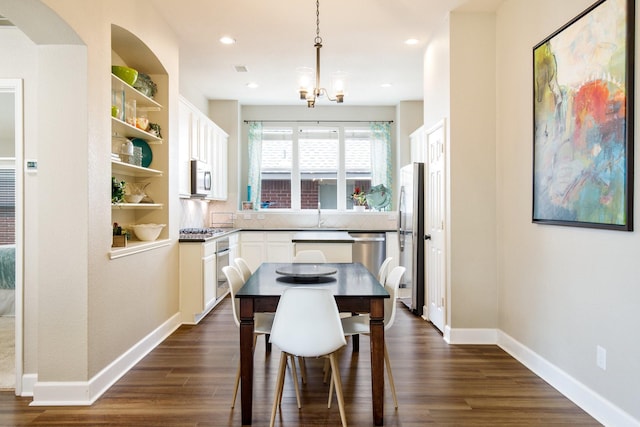 9121 Rio Blanco Dr, Frisco, TX 75033 - dining space featuring dark wood finished floors, baseboards, recessed lighting, and a chandelier