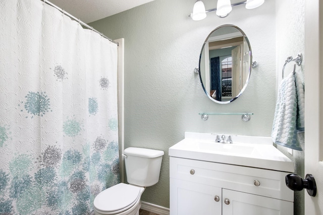 9121 Rio Blanco Dr, Frisco, TX 75033 - full bathroom featuring toilet, vanity, a textured wall, and a shower with curtain