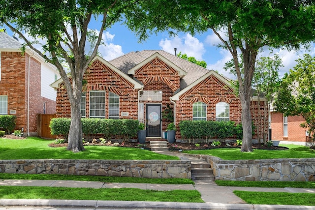 9121 Rio Blanco Dr, Frisco, TX 75033 - traditional-style home featuring brick siding and a shingled roof