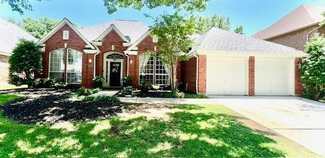 2904 Branch Hollow Cir, Flower Mound, TX 75028 - traditional home with a garage, driveway, and brick siding