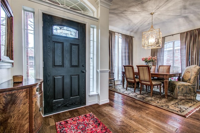 2904 Branch Hollow Cir, Flower Mound, TX 75028 - entrance foyer with a chandelier, wood-type flooring, and healthy amount of natural light