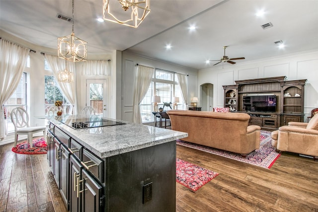 2904 Branch Hollow Cir, Flower Mound, TX 75028 - kitchen featuring a chandelier, black electric cooktop, crown molding, a ceiling fan, and open floor plan