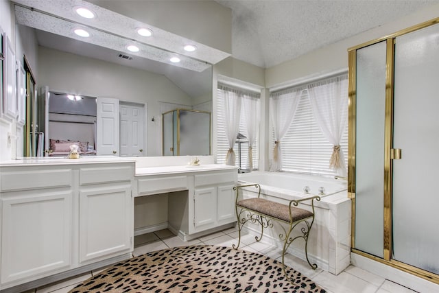 2904 Branch Hollow Cir, Flower Mound, TX 75028 - bathroom featuring a shower stall, double vanity, a garden tub, recessed lighting, and tile patterned flooring