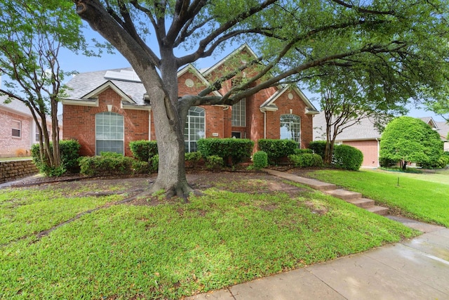 2445 Sky Harbor Dr, Plano, TX 75025 - traditional home with brick siding and a front lawn