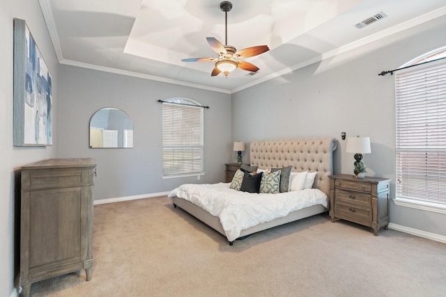 2445 Sky Harbor Dr, Plano, TX 75025 - bedroom with light colored carpet, a tray ceiling, multiple windows, and ornamental molding