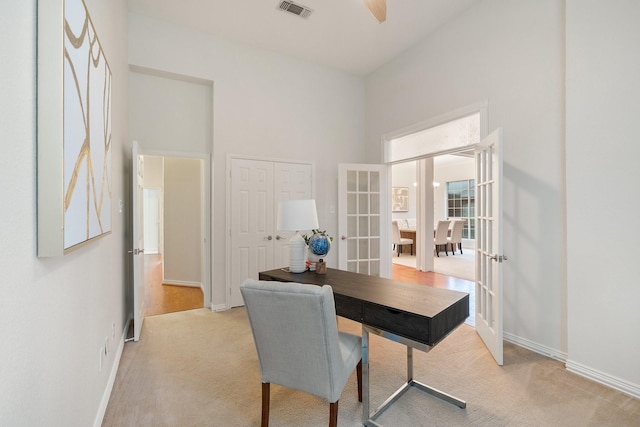 2445 Sky Harbor Dr, Plano, TX 75025 - office with light colored carpet, french doors, a high ceiling, and ceiling fan