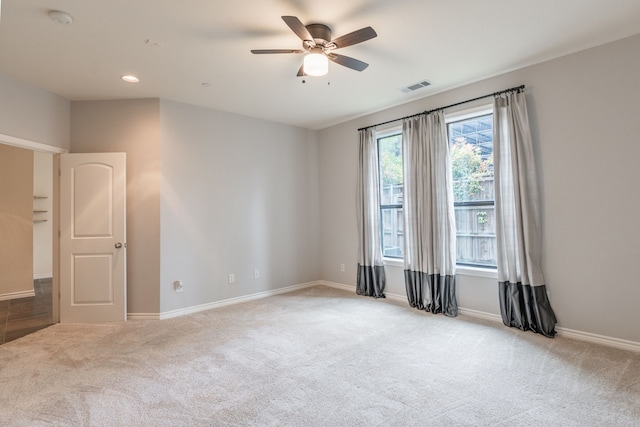 13900 Noel Rd Unit 2, Dallas, TX 75240 - spare room featuring light colored carpet, a smoke detector, a ceiling fan, and baseboards