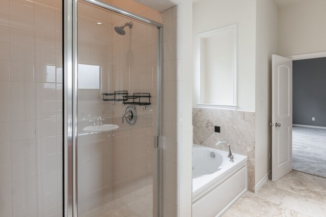 13900 Noel Rd Unit 2, Dallas, TX 75240 - full bath featuring a garden tub and a shower stall