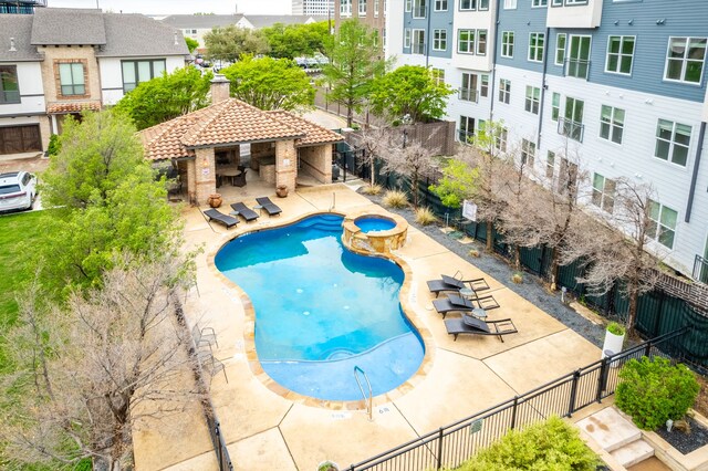13900 Noel Rd Unit 2, Dallas, TX 75240 - view of swimming pool featuring a gazebo, fence, a pool with connected hot tub, and a patio