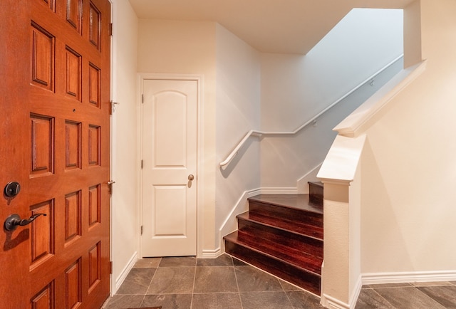 13900 Noel Rd Unit 2, Dallas, TX 75240 - entryway with stairway and baseboards