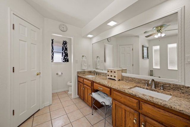 508 Quail Crest Dr, Colleyville, TX 76034 - full bathroom featuring toilet, tile patterned floors, a ceiling fan, double vanity, and baseboards