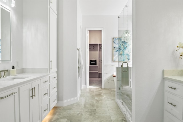 2512 Mona Vale Rd, Trophy Club, TX 76262 - full bathroom with a stall shower, vanity, a spacious closet, and baseboards