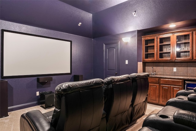 2512 Mona Vale Rd, Trophy Club, TX 76262 - cinema room featuring a textured wall, lofted ceiling, beverage cooler, and a textured ceiling