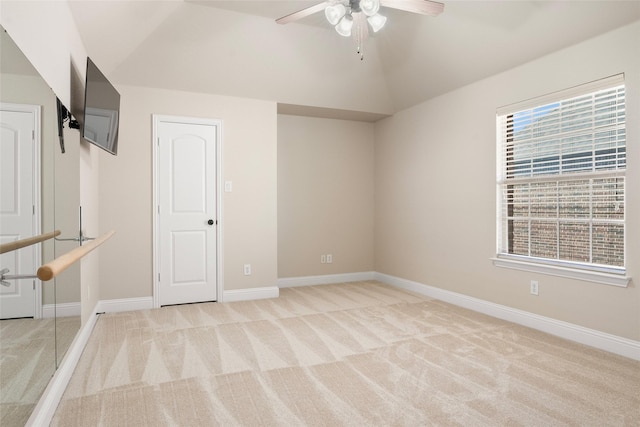 2512 Mona Vale Rd, Trophy Club, TX 76262 - spare room featuring light carpet, ceiling fan, vaulted ceiling, and baseboards