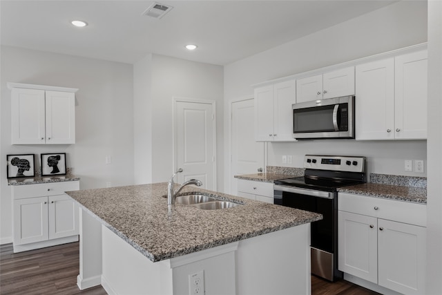 1802 Marquette Rd, Princeton, TX 75407 - kitchen with stainless steel appliances, a sink, a kitchen island with sink, dark wood-style floors, and recessed lighting
