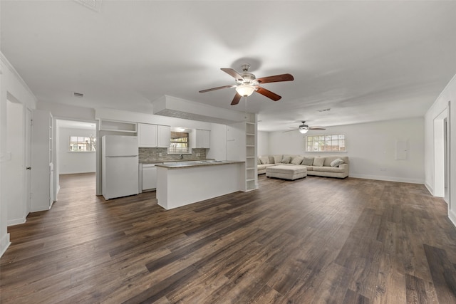 121 Faye St, Lacy Lakeview, TX 76705 - living area with ceiling fan, dark wood-type flooring, and baseboards