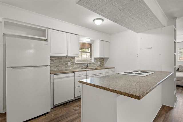 121 Faye St, Lacy Lakeview, TX 76705 - kitchen with white appliances, a sink, dark wood finished floors, white cabinets, and tasteful backsplash