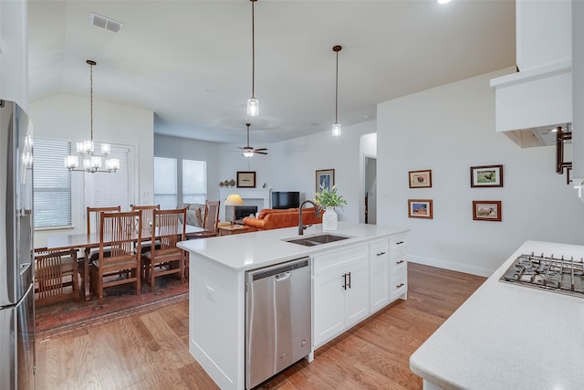 14601 Donner Trl, Fort Worth, TX 76262 - kitchen with a sink, appliances with stainless steel finishes, light wood finished floors, and light countertops